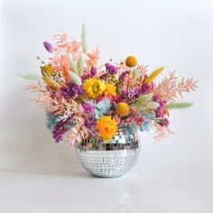 a disco ball filled with lots of colorful flowers