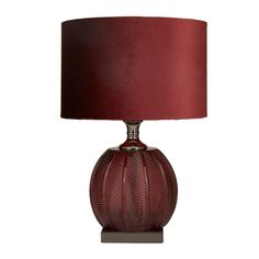 a table lamp with a red shade on it's base and a dark brown drum light