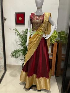 This Lehenga is made of pure soft silk fabric. The outfit is lined with satin.You can choose cotton or satin for lining. The outfit consist of crop top, skirt and dupatta.The top is heavily embroidered with mirrors and beads.A golden boarder is given at the hem edge of the skirt.Dupatta edges finished with a maroon beading.The colours can be customise according to your requirements.The outfit is a made to order dress. I will send a measurement sheet once you place the order. Cotton Silk Choli With Zari Work, Bollywood Cotton Silk Choli For Reception, Unstitched Cotton Silk Choli For Reception, Cotton Silk Lehenga With Zari Work For Reception, Traditional Cotton Silk Sets For Reception, Floor-length Cotton Silk Lehenga, Diwali Cotton Silk Choli With Zari Work, Designer Cotton Silk Lehenga With Traditional Drape, Resham Embroidered Cotton Silk Lehenga For Diwali