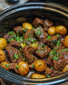 beef and potatoes in a crock pot with parsley