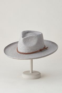 When the dress code reads "summer style but make it western," slip on the Nuvola, a beautifully crafted Toyo straw hat with a decidedly Old West flavor. Featuring a wide brim that's slightly rolled up at the edges and a tall teardrop crown, this timelessly fashionable straw hat is lightweight and ready for sunny days. It has a sweatband for comfort that's adjusted by hidden Velcro, and a braided faux leather hatband for a handsome finish. Business Travel Bag, Boots Square Toe, Sheepskin Slippers, Sheepskin Coat, Western Hats, Mens Gloves, Hat Band, Brim Hat, Womens Gloves