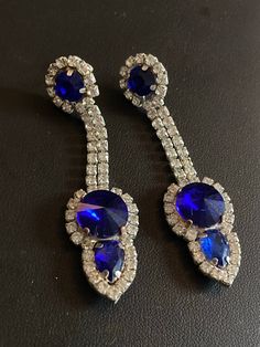 Vintage Czech Rhinestone SAPPHIRE BLUE and Clear Glass Paste Diamante Chandelier Dropper Drop pierced  Earrings Christmas  Genuine Old Shop Stock Sourced from Czechoslovakia from the town of Jablonec , home of the Czech bijouterie making tradition. Made in Czech recently from old shop stock fittings  - not reverse of earrings show age/tarnish/soldering - fronts are perfect!  Great for the Christmas Parties! Glamorous Blue Evening Earrings, Blue Crystal Jewelry With Rhinestones, Blue Dangle Crystal Earrings For Evening, Blue Dangle Jewelry For Party, Blue Drop Earrings For Evening, Royal Blue Crystal Jewelry For Party, Blue Dangle Party Jewelry, Blue Crystal Jewelry With Bling, Glamorous Blue Drop Earrings