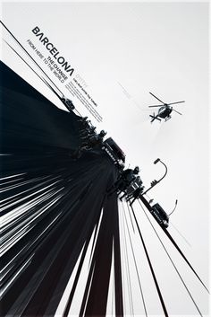 a helicopter flying over the top of a tall building