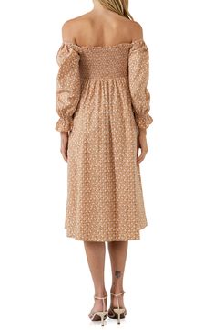 A ditsy floral print covers a muted long-sleeve midi dress with a smocked bodice, blouson sleeves and a twirly skirt. Lined 70% cotton, 27% nylon, 3% spandex Hand wash, dry flat Imported Fall Midi Dress With Gathered Sleeves, Fall Knee-length Midi Dress With Gathered Sleeves, Casual Smocked Dress With Ditsy Floral Print For Spring, Casual Smocked Dress With Ditsy Floral Print For Brunch, Casual Puff Sleeve Midi Dress For Fall, Smocked Top With Gathered Long Sleeves For Spring, Long Sleeve Smocked Top With Gathered Sleeves For Spring, Casual Knee-length Midi Dress With Elastic Sleeves, Floral Print Midi Length Smocked Dress For Daywear