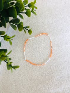 This orange beaded summer anklet is a cute accessory for any outfit and adds a pop of colour. It makes a great gift  for teens and adults. Casual Colorful Beads Anklets For Spring, Casual Colorful Beaded Anklets For Spring, Casual Colorful Beaded Spring Anklets, Orange Bead Bracelets For Beach, Orange Bead Bracelet For Beach, Orange Bracelet Beads For Beach, Summer Gift Beaded Bracelets With Beaded Chain, Trendy Summer Anklets With Round Beads, Trendy Beaded Chain Bracelets For Summer