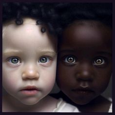 three children with curly hair and blue eyes