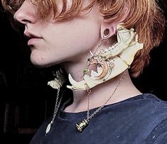 These double gauge hangers/earrings are made from naturally sourced jawbones collected by the maker. They also feature two distinct pendants that display angelic and astrological themes to create a very whimsical, elegant piece with a dark undertone. They are recommended to be worn with silicone ring gauges to create a more comfortable experience but can be worn with metal, or bare ears. They are designed for gauged ears and create a weight for the stretched lobe, but could potentially be worn w Character Design Jewelry, Jaw Bone Jewelry, 6 Gauge Ears, Non Piercing Earrings, Unique Accessories Fashion, Bohemian Bone-colored Earrings, Bohemian Bone-colored Pierced Earrings, Looking Over Shoulder Pose Drawing, Jaw Jewelry