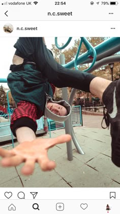 someone holding their hand out in front of a playground