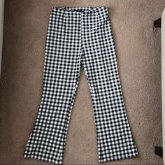 Gingham Flared Stretchy Crop Pants In Black And White. Plaid Cotton Bottoms For Picnic, Plaid Stretch Cotton Bottoms, Stretch Plaid Cotton Bottoms, Casual Gingham Trousers, Gingham Cotton Bottoms For Fall, Fitted Cotton Bottoms For Picnic, Trendy Wide Leg Gingham Pants, Casual Plaid Bottoms For Picnic, Plaid Cotton Bottoms With Houndstooth Pattern