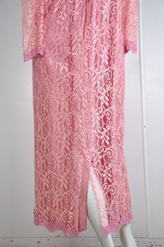 "A darling pink lace dress by JC Penney circa the 60s / 70s. It has little snaps at the sleeves, nape, and bust. There's a back zipper closure with a natural opening in the lace fabric to allow for the zipper to move. Made in the USA. Would suit a small or petite medium, but please see measurements below for accurate fit. CONDITION: Great gently worn condition. No flaws to note. MEASUREMENTS Bust: 38\" Waist: 30\" Length: 51\" Have a question? Please ask me anything." Pink Lace Floor-length Dress, Pink Floor-length Lace Dress, Pink Lace Dress With Lace Patchwork, Fitted Pink Lace Dress With Delicate Details, Pink Spring Lace Dress With Delicate Details, Pink Delicate Lace Dress For Spring, Spring Pink Delicate Lace Dress, Fitted Pink Dress With Delicate Lace, Feminine Pink Lace Dress For Formal Occasions