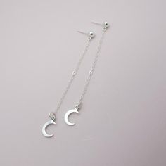 SOLID STERLING SILVER EARRINGSThese celestial earrings make a wonderful gift. The real sterling ear studs are adorned with a tiny moon that dangles elegantly on sterling silver chain. Comes in a gift box, perfect for gift giving. Total earring length is approximately 2 3/4 inches long. ALSO AVAILABLE IN A STAR DESIGN OR MOON/STAR COMBO Dainty Hypoallergenic Moon-shaped Earrings, Dainty Moon-shaped Hypoallergenic Earrings, Dainty Moon Shaped Hypoallergenic Earrings, Dainty Hypoallergenic Moon Earrings, Adjustable Moon-shaped Minimalist Earrings, Sterling Silver Celestial Earrings For Everyday, Sterling Silver Celestial Earrings For Gift, Minimalist Crescent Earrings For Gift, Silver Moon-shaped Earrings For Gift