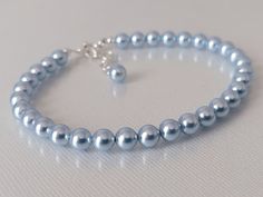 This is a RESERVED listing for Special Customer! Wedding Light Blue Blush Blue Colored Pearl Silver Dainty Bridal Bracelet. BRACELET is about 8 inches (20.3cm) long plus 1 inch extender chain. BRACELETS SECTION: https://www.etsy.com/shop/LanaChayka?ref=simple-shop-header-name&listing_id=892586384&sort_order=date_desc§ion_id=14226470 BRIDAL BRACELETS SECTION: https://www.etsy.com/shop/LanaChayka?ref=seller-platform-mcnav§ion_id=25839214 Classic and elegant, this dainty bracelet is perfect for wed Blue Round Beads Bracelet For Wedding, Blue Round Bead Bracelets For Weddings, Adjustable Blue Crystal Bracelet For Wedding, Light Blue Round Beads Jewelry For Wedding, Blue Beaded Bracelets For Weddings, Elegant Adjustable Light Blue Crystal Bracelet, Adjustable Blue Beaded Bracelets For Wedding, Elegant Light Blue Adjustable Crystal Bracelet, Adjustable Blue Pearl Bracelet For Wedding