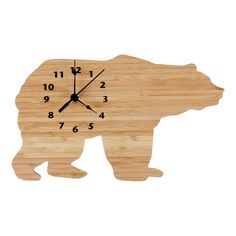 a wooden clock with a bear design on it