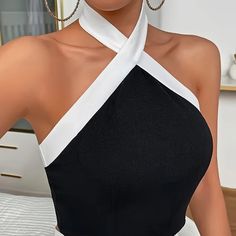 Elevate Your Wardrobe With Our Stylish Contrast Trim Backless Crisscross Tank Top In Black And White. Perfect For Any Occasion, This Top Features An Elegant Halter Neck And Sleeveless Design. The Backless Detail And Crisscross Straps Add Allure And A Trendy Twist To A Classic Silhouette. Made With High-Quality Materials, This Top Is Both Fashionable And Comfortable. Upgrade Your Look With This Versatile Piece That Will Turn Heads Wherever You Go. Xxl/14 Bust: 42.2-44.5in Waist: 34.3-36.6in Compo Stretch Sleeveless Cross-tied Halter Top, Halter Neck Top With Crisscross Straps For Night Out, Chic Sleeveless Cross-tied Tops, Elegant Sleeveless Bandage Crop Top, Chic Crisscross Halter Top With Cross-tied Details, Night Out Halter Neck Top With Crisscross Straps, Black Stretch Halter Top With Cross Back, Stretch Cross Back Tops For Party, Stretch Cross Back Party Tops