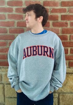 Champion Auburn Tigers Mens Grey Powerblend Tackle Twill Long Sleeve Crew Sweatshirt - 14754790 Athletic Heather Fan Apparel Sweatshirt For Fall, Collegiate Sweats With Ribbed Cuffs For Streetwear, Gray Fall Fan Gear Sweatshirt, Gray Fan Apparel Sweatshirt For Sports Season, Varsity Crew Sweatshirt For College, Varsity Fleece Sweats For Fall, Fall Varsity Sweatshirt With Team Logo, Varsity Style Sweatshirt For College Sports Season, Varsity Sweatshirt For College Sports Season