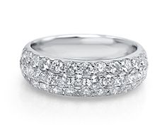 a white gold wedding band with rows of round brilliant cut diamonds on the outside and inside