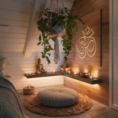 a bed room with a large plant on the wall and candles in front of it