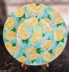 a glass plate with oranges on it