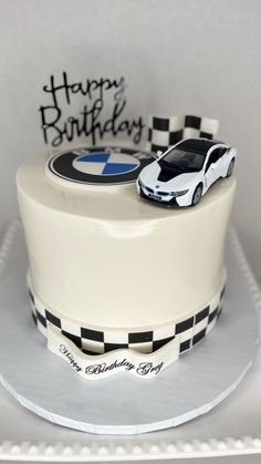 a birthday cake with a car on top