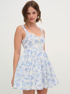 Vintage-inspired toile embroidered mini dress featuring a ruffled sheer organzatrim details and white contrast piping throughout the bodice. Hook & eye detailing at bust. Floral Gowns, Floral Mini Dresses, White And Blue Dress, Rose Print Dress, Blue Dress Short, Mini Dress Blue, Blue Lace Dress, Upcycle Ideas, Floral Gown