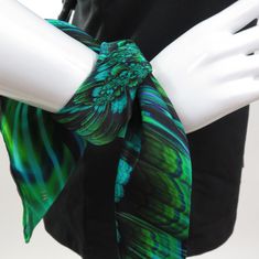 "This flirty little 16\" mini scarf is just big enough to add a sophisticated accent to your outfit without bulk. \"Reaction\" is a Fractal design in brilliant green. Bright colors in art-to-wear on very high quality silk satin tiny scarf with a hand-rolled hem. * Digitally printed original design * 100% silk satin * Approx. 16\" square * Hand-rolled hem * Dry clean or hand wash in cold water * Ironing OK. Use of press cloth recommended. * Arrives packed in an elegant gift-box IMPORTANT SIZING N Green Silk Scarves For Formal Occasions, Elegant Green Scarves For Spring, Formal Green Silk Scarves, Elegant Green Scarf For Formal Occasions, Green Square Scarf For Spring, Green Square Silk Scarf For Spring, Elegant Green Scarves As Gifts, Elegant Green Scarves For Gifts, Trendy Green Scarves As Gift