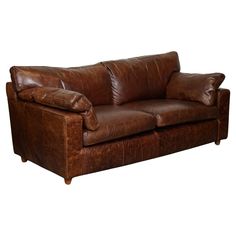 We are delighted to offer for sale this Vintage Brown Heritage Leather 2 to 3 Seater Sofa is a classic and elegant piece of furniture that exudes timeless charm and sophistication. Crafted from high-quality brown leather with a vintage finish, this sofa has a rich and warm hue that adds character and depth to any living space. With its 2 to 3 seater size, the sofa offers ample seating for small gatherings or cozy nights in. The design features clean lines, tufted details, and classic rolled arms Brown Leather Loveseat, Cognac Leather Sofa, Sofas Vintage, Brown Leather Couch, Brown Leather Armchair, Leather Sofa Living Room, Brown Leather Sofa, Leather Couch, Leather Loveseat