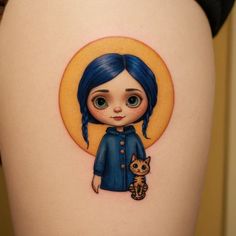 a girl with blue hair and a cat on her thigh is depicted in this tattoo