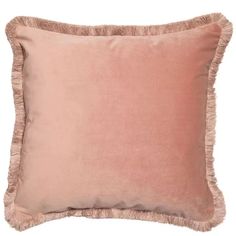 a pink pillow with fringe trim on the front and back of it, against a white background