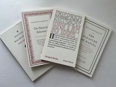 three booklets are stacked on top of each other, with the same text in red and white