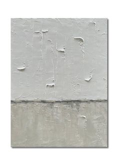 an abstract painting with white paint on the wall