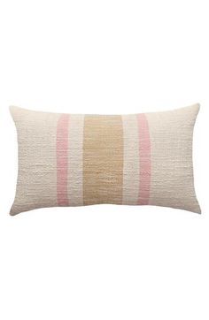 a beige and pink striped pillow on a white background