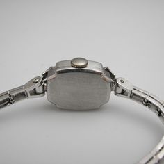 "For sale: (1) g123 14k White Gold Women's Diamond Elgin Watch PLEASE READ ENTIRE DESCRIPTION BEFORE PURCHASING Pre-owned item. Good condition. Please see pictures for details. Sold as is, as seen on pictures. This beautiful ladies Elgin Art Deco watch contains 62 diamonds, all of which are round cut. It is stamped. Specifics: 14k White gold Diamonds: .86TCW Mechanical Length: 5.5 inches Case size with crown: 15.9 mm Lug width: 4mm Please be 100% sure of your purchase before buying, as we do not Evening Jewelry And Watches With Round Dial, Silver Formal Watch Bands, Silver Watch Bands For Formal Occasions, Formal Silver Watch Bands, Round Dial Jewelry With Polished Finish For Anniversary, Formal Silver Engraved Diamond Watch, Silver Rectangular Diamond Watch For Formal Events, Silver Engraved Diamond Watch For Formal Occasions, Classic Engraved Jewelry And Watches For Formal Occasions