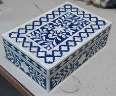 a blue and white box sitting on top of a table