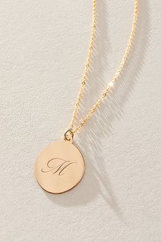 Just as effortless as it is elegant, this stunning necklace features an oval pendant with gorgeous cursive engraved initial for the ideal finishing touch. * 14k Gold Filled chain * Personalized, laser engraved, 14k Gold Filled 17x22mm oval pendant * Length: 20" * 5 days of production | Set & Stones Personalized Amelia Necklace at Free People in Gold Classic Necklace With Engraving Option, Luxury Engraved Initial Pendant Necklace, Elegant Initial Pendant Necklace For Formal Occasions, Elegant Monogram Charm Necklace For Personalized Gift, Elegant Monogram Charm Necklace, Elegant Monogram Initial Pendant Necklace, Elegant Initial Necklace With Monogram Round Pendant, Elegant Medallion Initial Necklace As Gift, Elegant Medallion Initial Necklace Gift