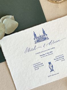 the wedding stationery is laid out on the table