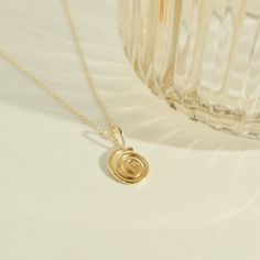 Embrace the essence of growth and evolution with our handcrafted gold-filled Mini Spiral pendant necklace. This elegant piece symbolizes continuous development and life's journey, capturing the beauty of expansion and progress in its timeless design. Perfect for those who appreciate meaningful and exquisite jewelry. Handcrafted in the USA. DETAILS: Material: 14/20 gold-filled, Skin Friendly Dimensions: Pendant 10mm Chain Length 18" plus 2" extender chain Note: As each piece is handcrafted dimensions and shapes can slightly vary ensuring no two are exactly alike. Spiral Gold-plated Jewelry, Minimalist 14k Gold Spiral Jewelry, Elegant Gold Swirl Necklace, Dainty Spiral Jewelry For Everyday, Swirl Shaped Yellow Gold Jewelry Gift, Yellow Gold Swirl Jewelry Gift, Gold Spiral Necklace As A Gift, Gold Spiral Necklace For Gift, Gold Spiral Necklace For Gifts