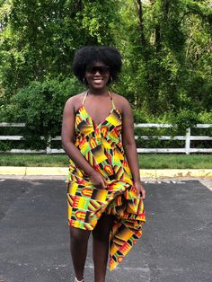 This kente Dress is gorgeous for the summer and very vibrant. Dress is halter style Has adjustable strings that tie to the neck and back Dress is high low style Material is light weight Very comfortable fit Strings can be tied at the shoulder or back Attention grabbing dress. Can be worn at the beach To parties and cook outs Green Halter Neck Backless Dress For Beach, Multicolor Beachwear Halter Dress For Beach, Yellow Tie Back Mini Dress For Beach, Multicolor Backless Sundress For The Beach, Backless Multicolor Sundress For Beach, Multicolor Backless Sundress For Beach, Green Backless Summer Dress For Beach, Multicolor Sundress Halter Dress For Vacation, Multicolor Halter Neck Dress For The Beach