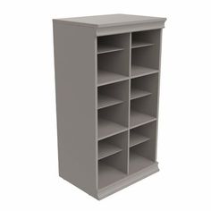 a gray bookcase with many shelves on it