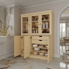 an open cabinet in the middle of a kitchen