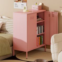 a pink locker next to a bed in a room