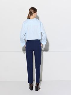 The Charlotte is tailored for a relaxed fit with a cropped ankle length. With its mid-rise fit and fuller silhouette thru the hips and thighs which then tapers to the hem, the Charlotte is an elevated take on a menswear-inspired trouser. The crepe jersey fabric has a 4-way stretch, making the Charlotte the most comfortable trouser to wear, and its compact weave makes it practically wrinkle-free. Perfect for travel. The fabric is FSC certified responsible and ecologically resourced. Made in Italy Relaxed Fit Work Pants With Button Cuffs, Spring Tapered Pants For Workwear, Spring Tapered Workwear Pants, Relaxed Fit Dress Pants With Straight Hem For Work, Tapered Pants For Spring Workwear, Casual Office Pants With Straight Hem, Slim Fit Straight Hem Work Bottoms, Slim Fit Bottoms With Straight Hem For Work, Slim Fit Workwear Bottoms With Straight Hem