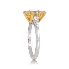 This ring features a GIA-certified 1.01 carat marquise-cut Fancy Yellow diamond set in prongs. This ring is 18k yellow gold on platinum. The shoulders are set with tapered baguette diamonds, the combined weight of which is 0.20 carats.
The measurements of the center stone are approximately 11.75mm x 4.80mm.
This ring can be resized to any finger size at no extra cost.
If you have any questions about the Alameda ring, please feel free to contact us. Gia Certified Marquise Diamond Ring Fine Jewelry, Yellow Marquise Rings For Anniversary, Gia Certified Marquise Diamond Ring For Anniversary, Gia Certified Marquise Cut Yellow Gold Wedding Ring, Gia Certified Yellow Gold Marquise Diamond Ring, Gia Certified Yellow Gold Marquise Cut Wedding Ring, Gia Certified Platinum Marquise Rings, Gia Certified Marquise Platinum Rings, Gia Certified Marquise Cut Yellow Gold Ring