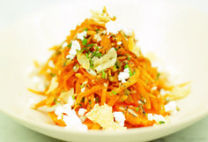 a white bowl filled with food on top of a table