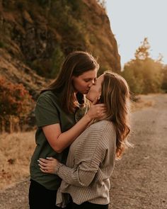 two women kissing each other on the road