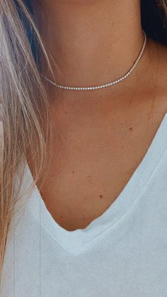 Cubic Zirconia Tennis Necklace | 14K Gold Filled | 2.2 MM Diamond Tennis Choker Necklace | Bridal Jewelry | Dainty Minimalist Necklace ------------------------------------------------- ♦ --------------------------------------------------- Beautiful Tennis choker necklace. It compliments any outfit. A wonderful gift for yourself or for any loved one and friend - purchase one today!♦ Materials: 18K Gold Filled ♦ Available colors: Gold ♦ Necklace measurements: the total length is 15.5" and the ston Dainty Crystal Diamond Necklace For Formal Occasions, Classic Diamond Choker Jewelry, Dainty Diamond White Crystal Necklace, Dainty White Diamond Crystal Necklace, Dainty White Crystal Diamond Necklace, Minimalist White Crystal Jewelry, Classic Rhinestone Necklace With Diamond Accents In Diamond White, Classic Rhinestone Necklace With Diamond Accents, Diamond White, Dazzling Cubic Zirconia Jewelry With Delicate Chain