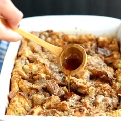 an easy baked french toast casserole is being drizzled with honey