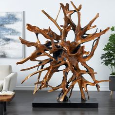 a large wooden sculpture sitting on top of a table