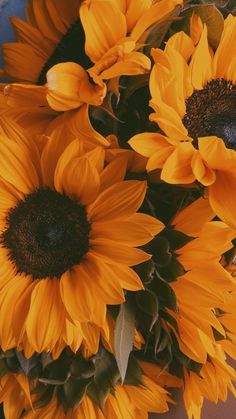 a bouquet of sunflowers sitting on top of a table