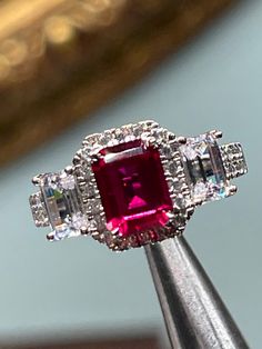 Man made emerald cut ruby, AAA grade laser cut cz set in Sterling silver, ring size 7 1/4 Red Ruby Ring With Vvs Clarity And Baguette Cut, Ruby Diamond Ring With Vvs Clarity And Baguette Cut, Asscher Cut Ruby Ring With Diamond, Fine Jewelry Ruby Ring With Radiant Cut Center Stone, Red Emerald Cut Diamond Rings, Radiant Cut Ruby Ring In Fine Jewelry Style, Radiant Cut Ruby Ring Fine Jewelry, Radiant Cut Ruby Ring With Center Stone, Formal Radiant Cut Ruby Ring With Center Stone