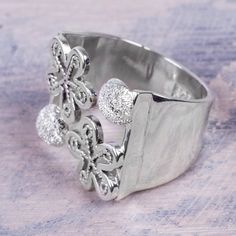 Peru's Maria Huerta transforms sterling silver into a beautiful wrap ring. Crafted by hand it depicts the shy urban blossoms that grow in the historical World Heritage Site of Rimac. Silver Metal Flower Ring As Gift, Silver Metal Flower Ring For Gift, Silver Metal Flower Ring Gift, Adjustable Nickel-free Silver Flower Ring, Silver Metal Flower Ring For Wedding, Nickel-free Silver Open Flower Ring, Silver Metal Flower Ring For Anniversary, Silver Wrap Ring, Handcrafted Silver Jewelry